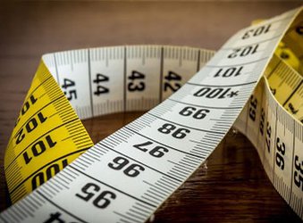 Sounds of moving objects change perceptions of body size