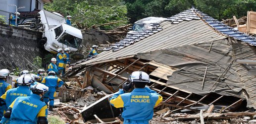 More than 100 dead as floods and landslides devastate south-west Japan